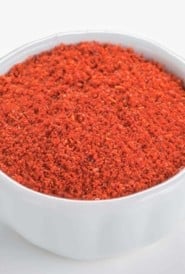 close up of white bowl filled with Taco Seasoning, showing vibrant color.