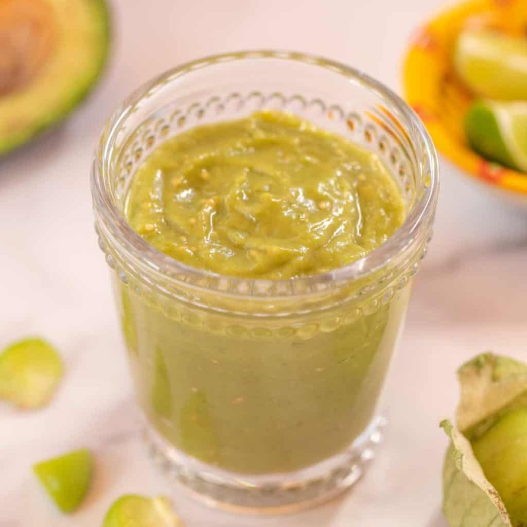 clear glass filled with Tomatillo Avocado Sauce