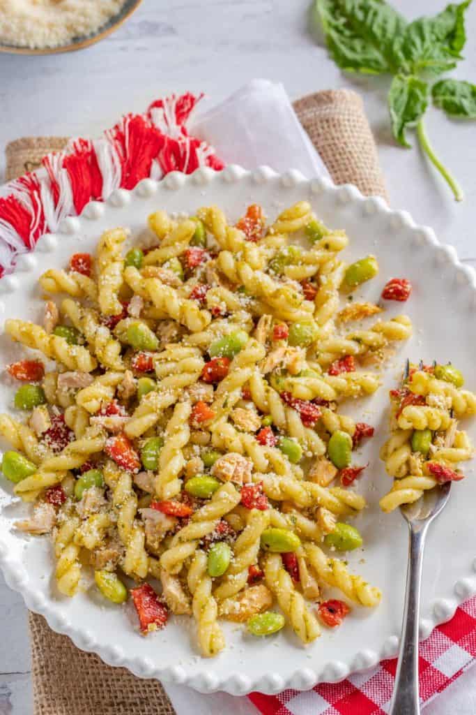 White plate filled with a portion of Tuna and Roasted Red Pepper Pasta Salad