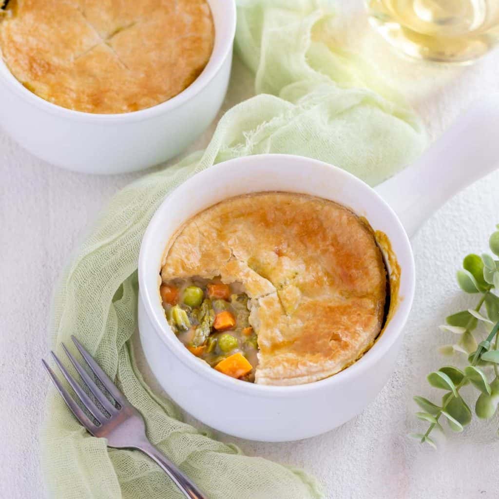 One portion of Vegetarian Pot Pie with part of the crust removed to show filling