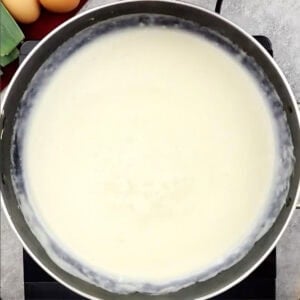 Skillet holding basic white sauce, showing thickness
