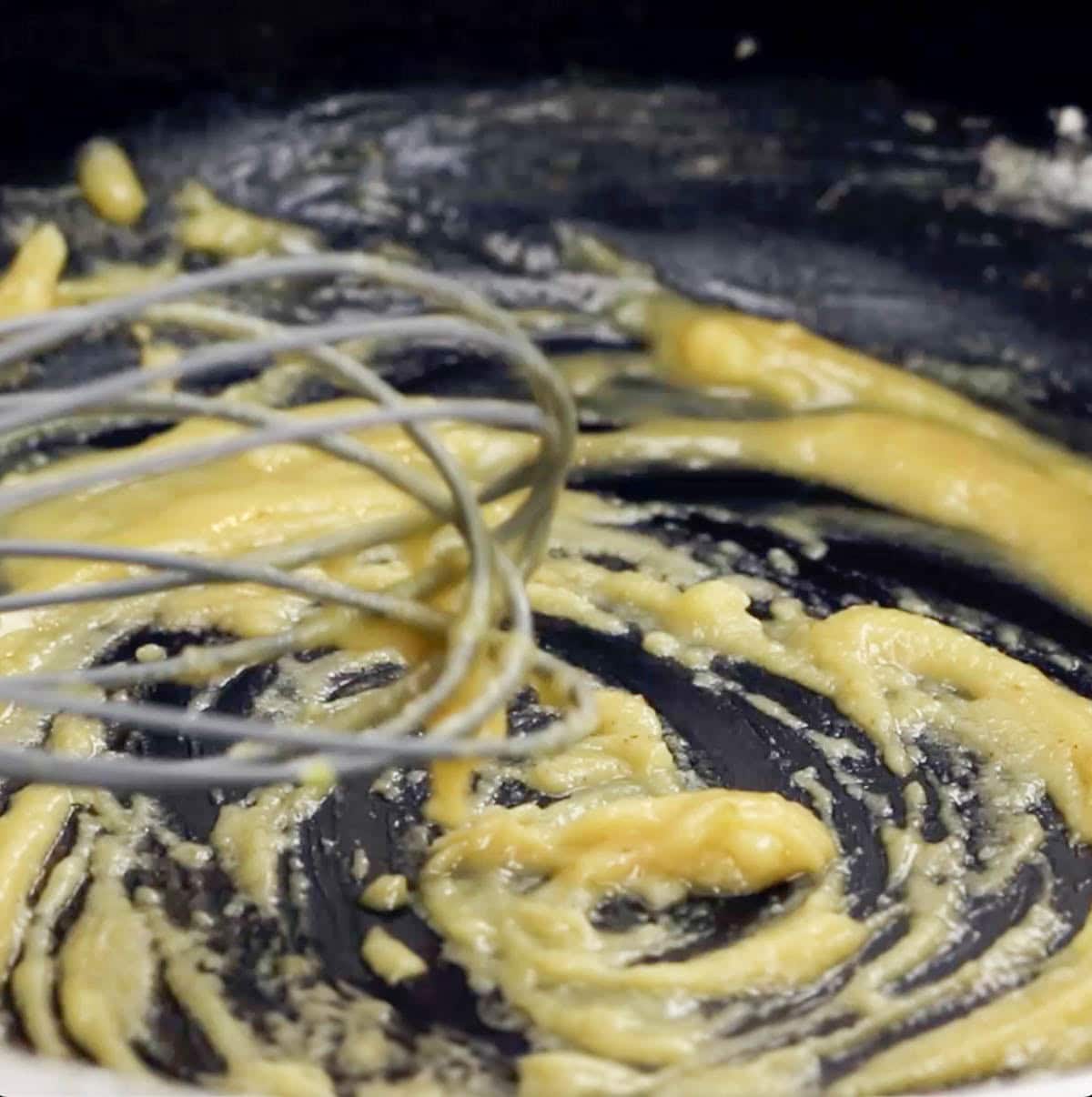 process shot showing what the roux (butter and flour mixture) looks like after whisking and cooking for 3 minutes