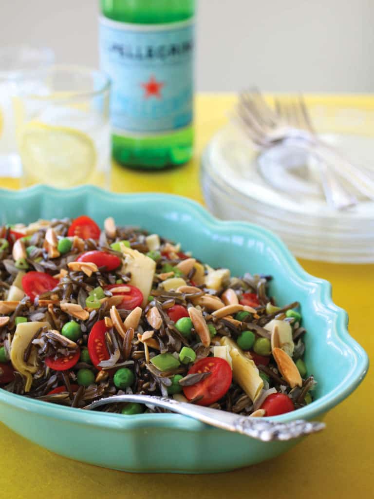 Oval blue bowl filled with Elegant Wild Rice Salad with Parmesan Vinaigrette